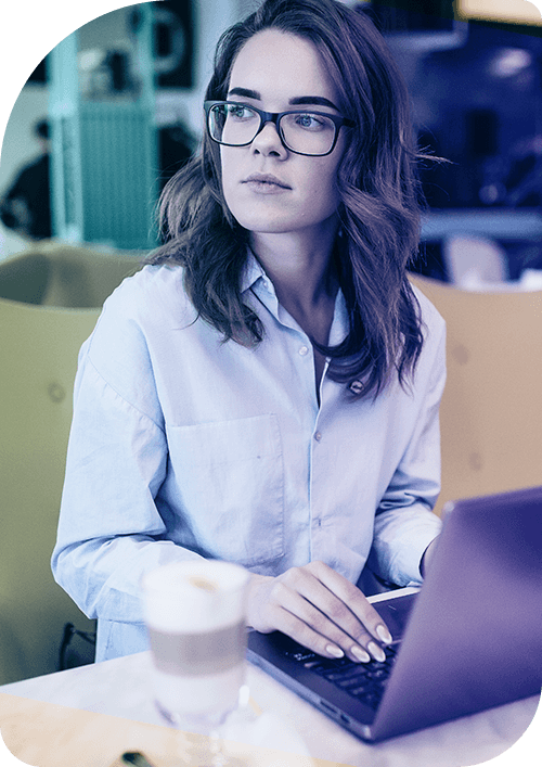 Young woman with laptop and coffee